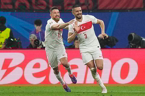 Merih Demiral celebrates after scoring Turkey's second goal